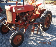 FARMALL CUB TRACTOR W. PLOW & CULTIVATORS